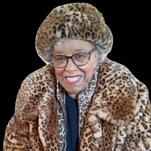 Portrait of a smiling elderly woman in a leopard-print fur coat and hat