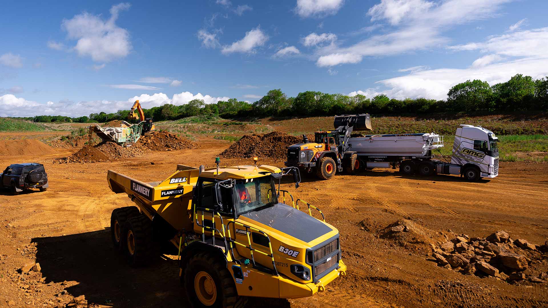 ETC construction site with excavators, dumpers, and tipper trucks working on large-scale earthworks project