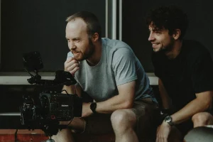 Jacques and Reilin filming with a camera