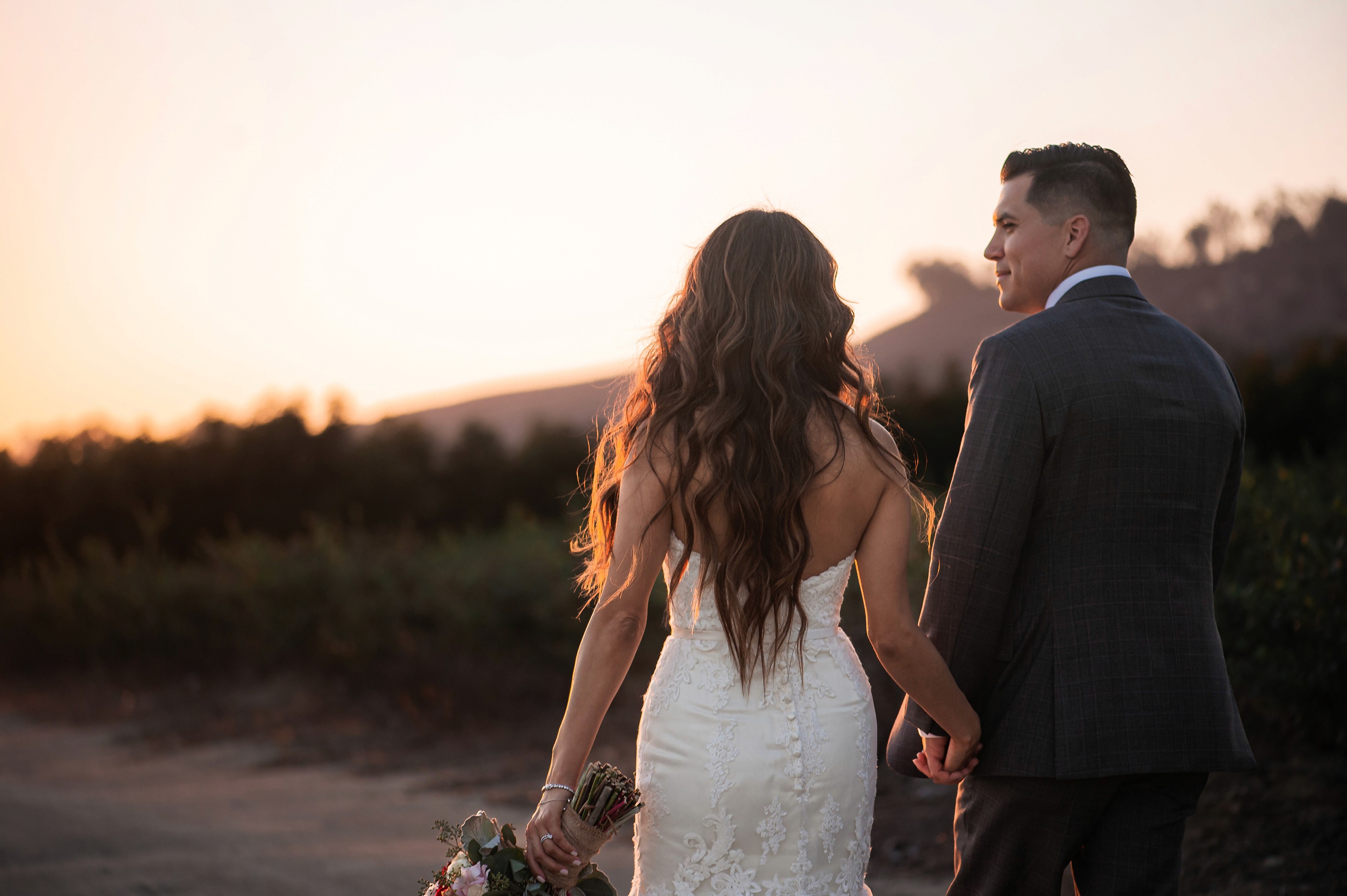 Flat lay wedding details with bouquet, rings, and sparkling bridal heels