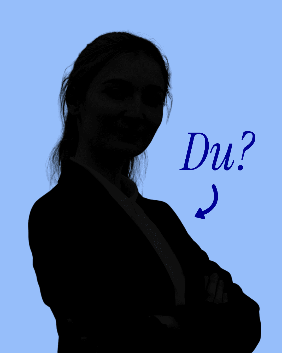 Smiling young woman with long hair standing against a dark green background, holding a finger to her chin.