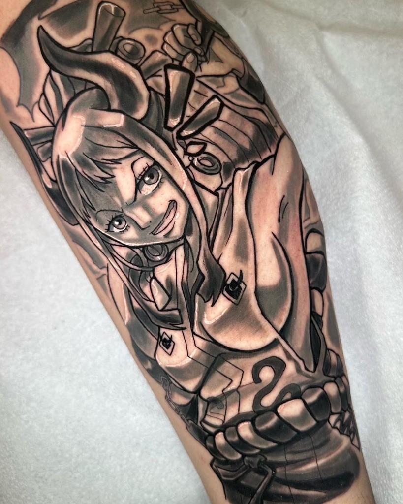 Detailed black and grey tattoo of Yamato, Kaido’s daughter from One Piece, with expressive shading and dynamic composition by DKGreySenpai