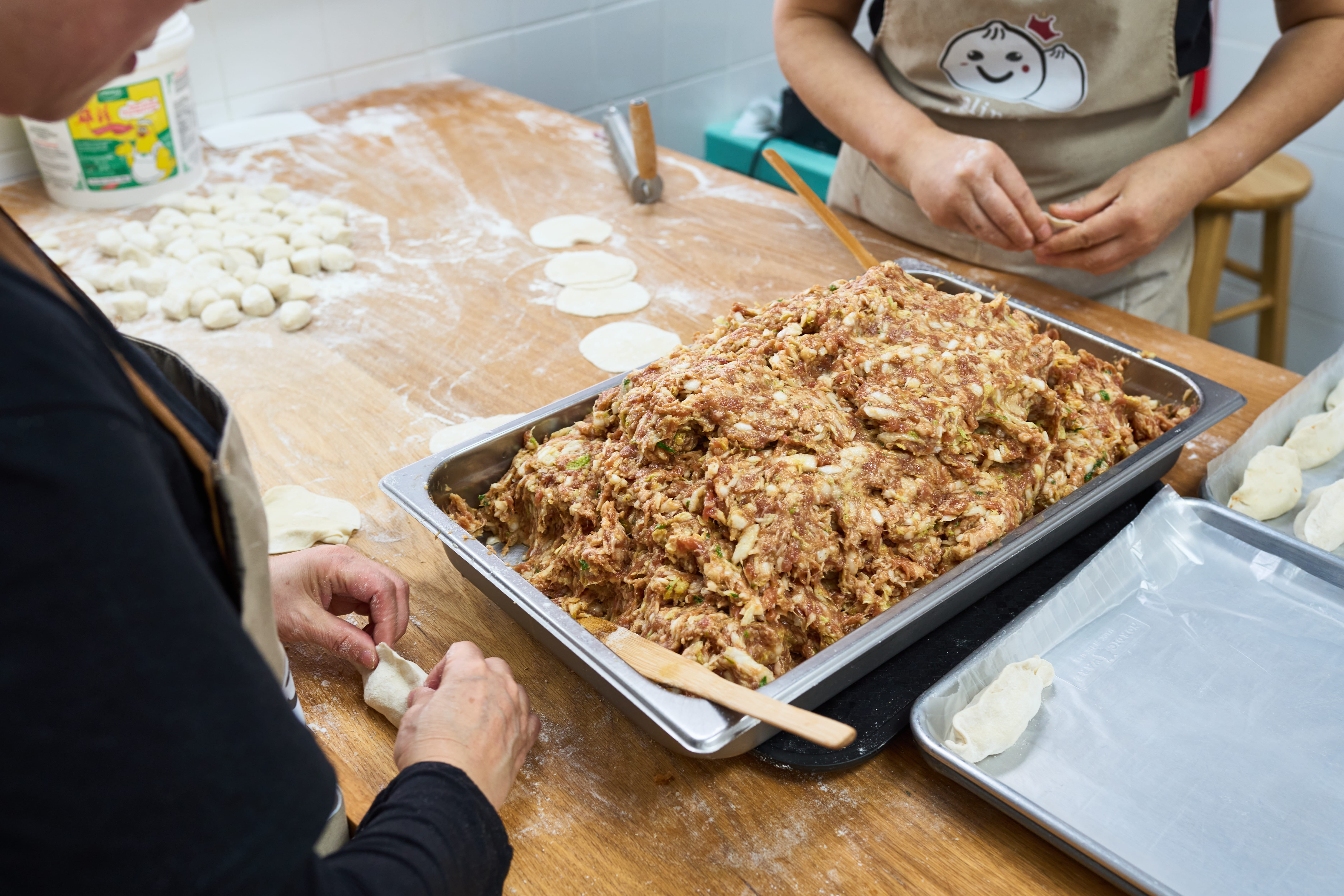 Dumpling King employee making the dumplings