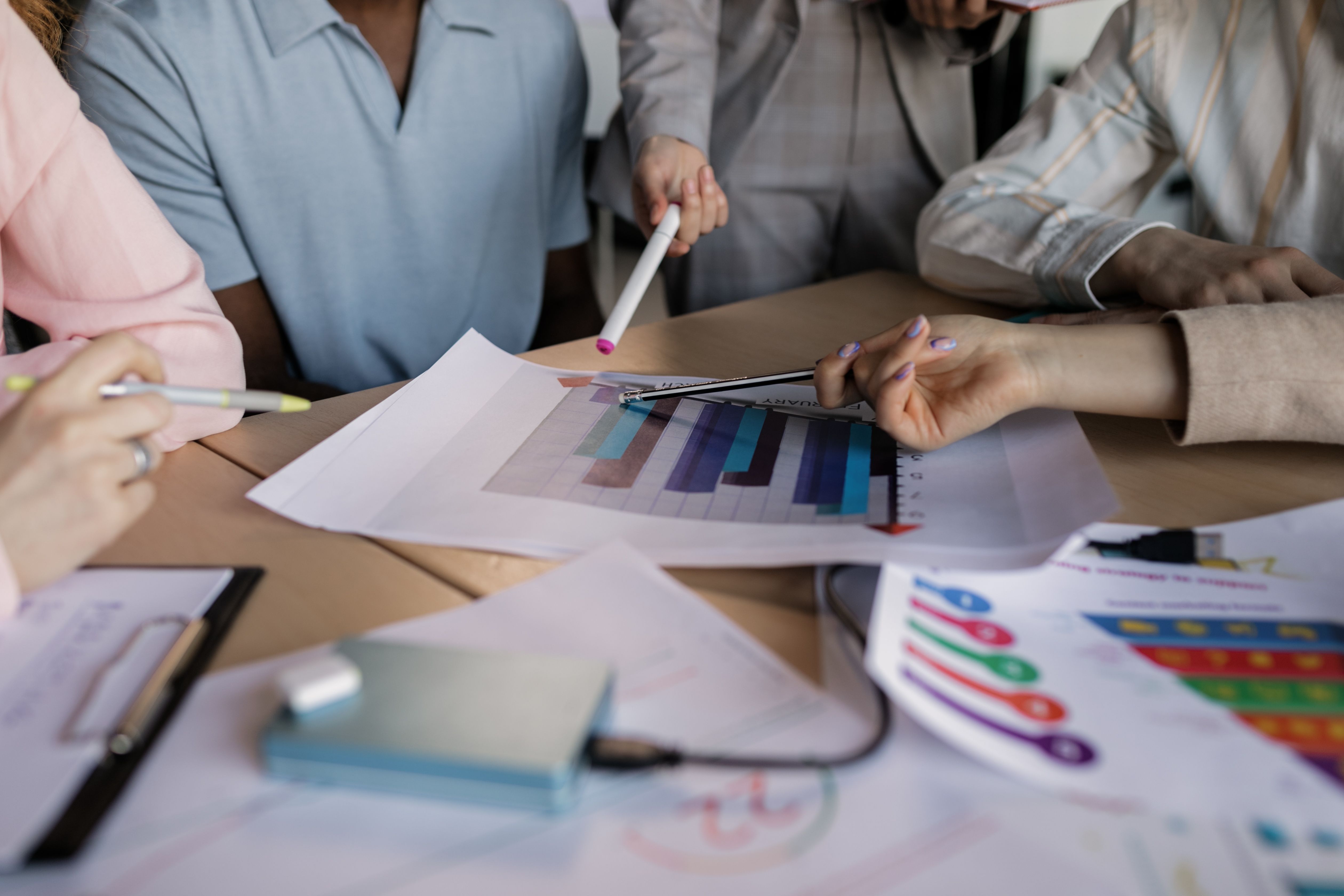 a-diverse-team-engaged-in-planning-and-discussing-a-business-strategy-around-a-w - alena-darmel (pexels)