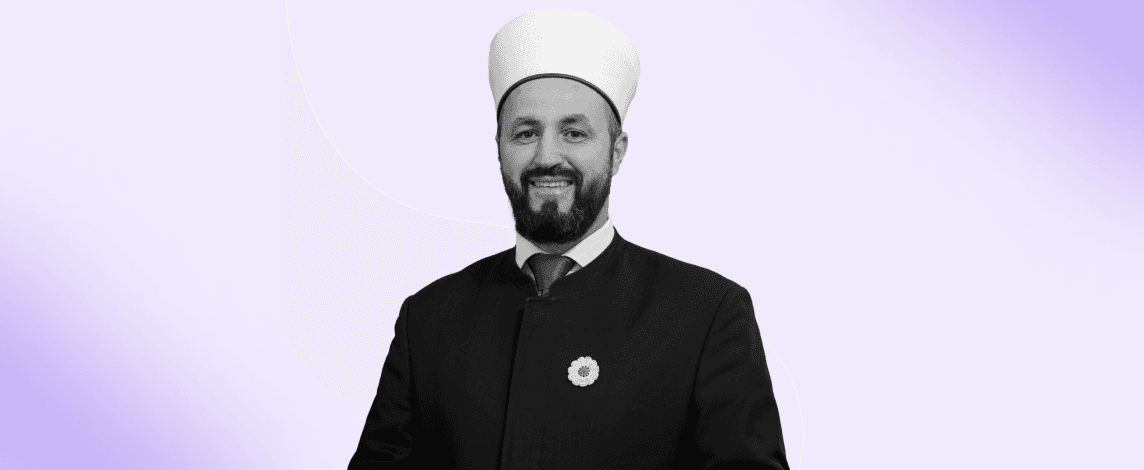 Muslim man in traditional attire making the Adhan, the Islamic call to prayer, symbolizing the practice of announcing Salah times.