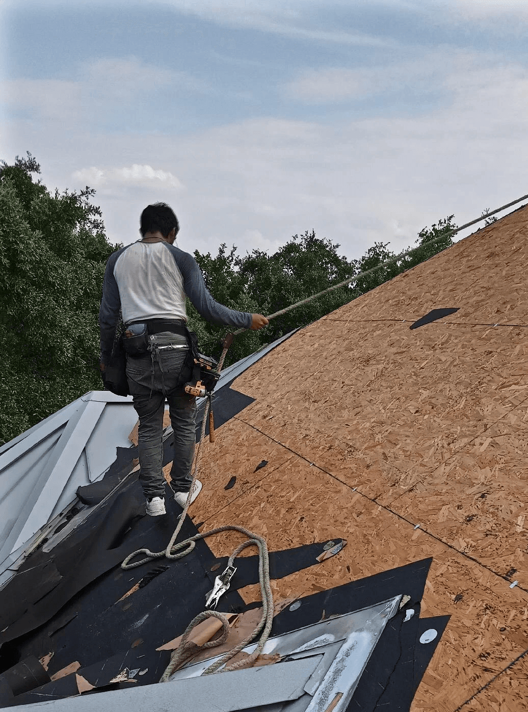 Installing a new metal roof standing seam.