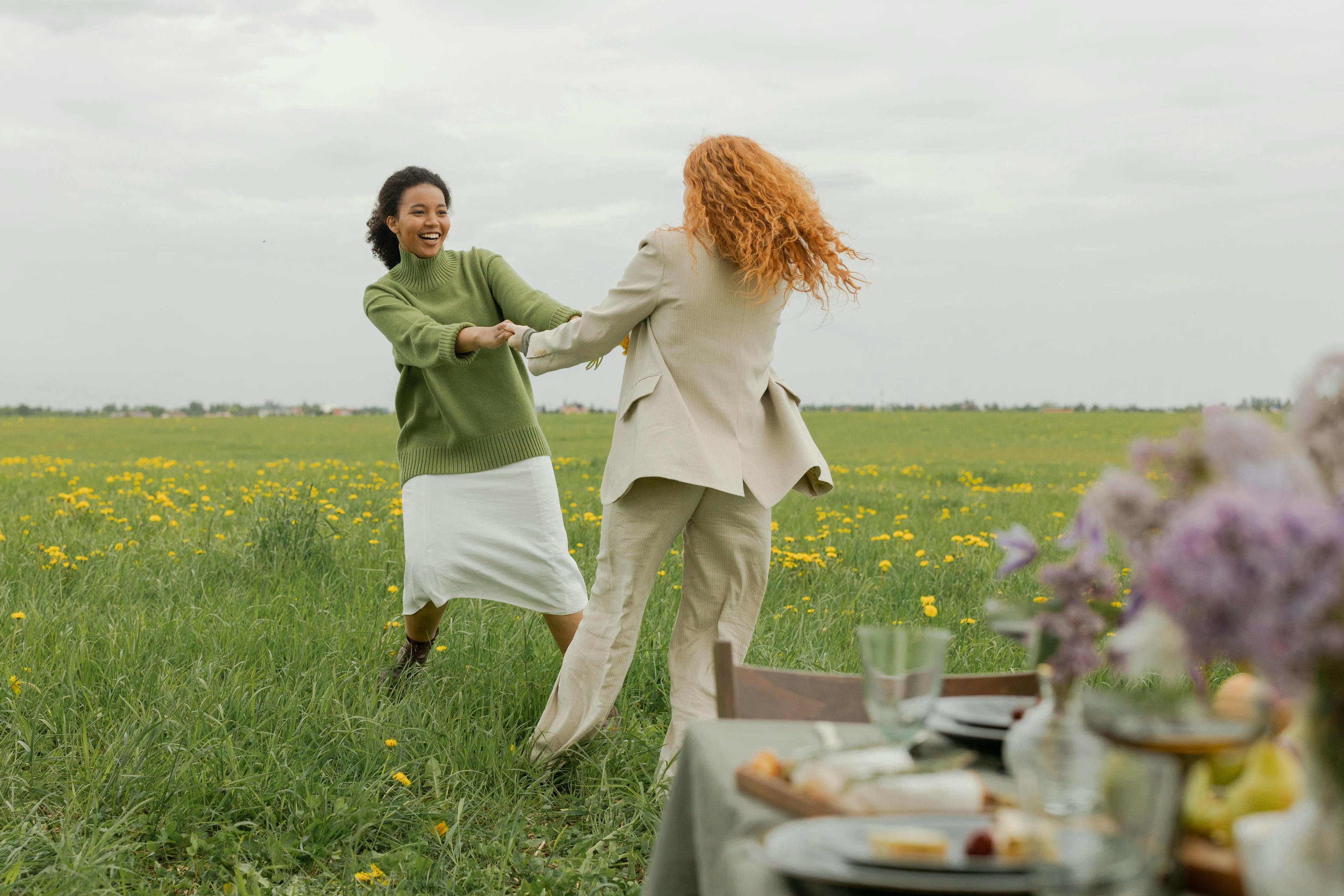 Women dancing in a field