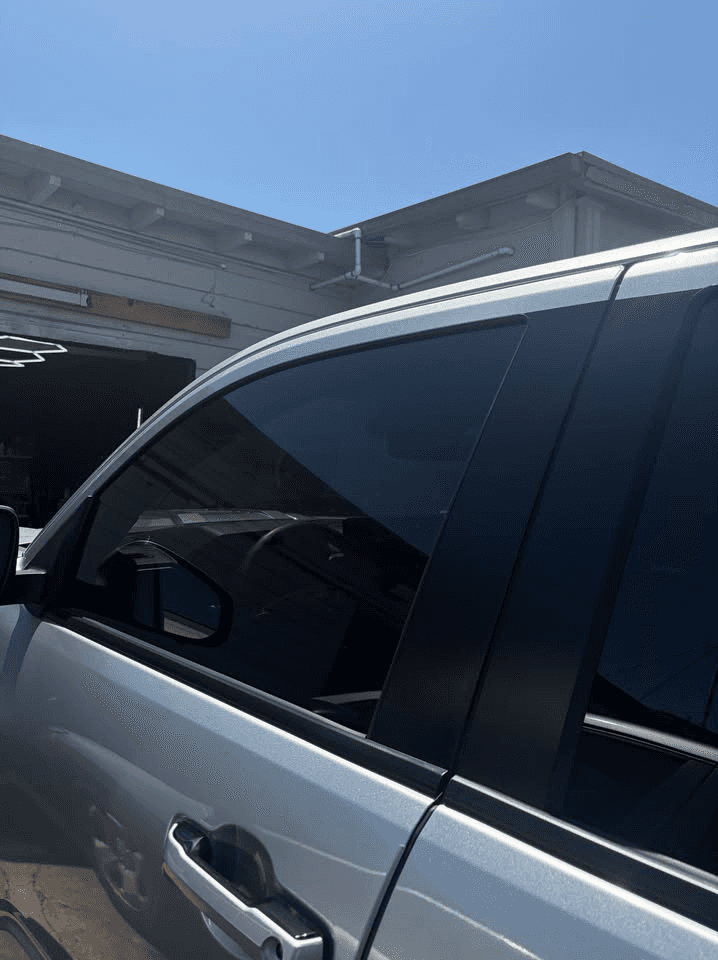 Blue SUV with professional auto window tint installation by Flare Tinting.