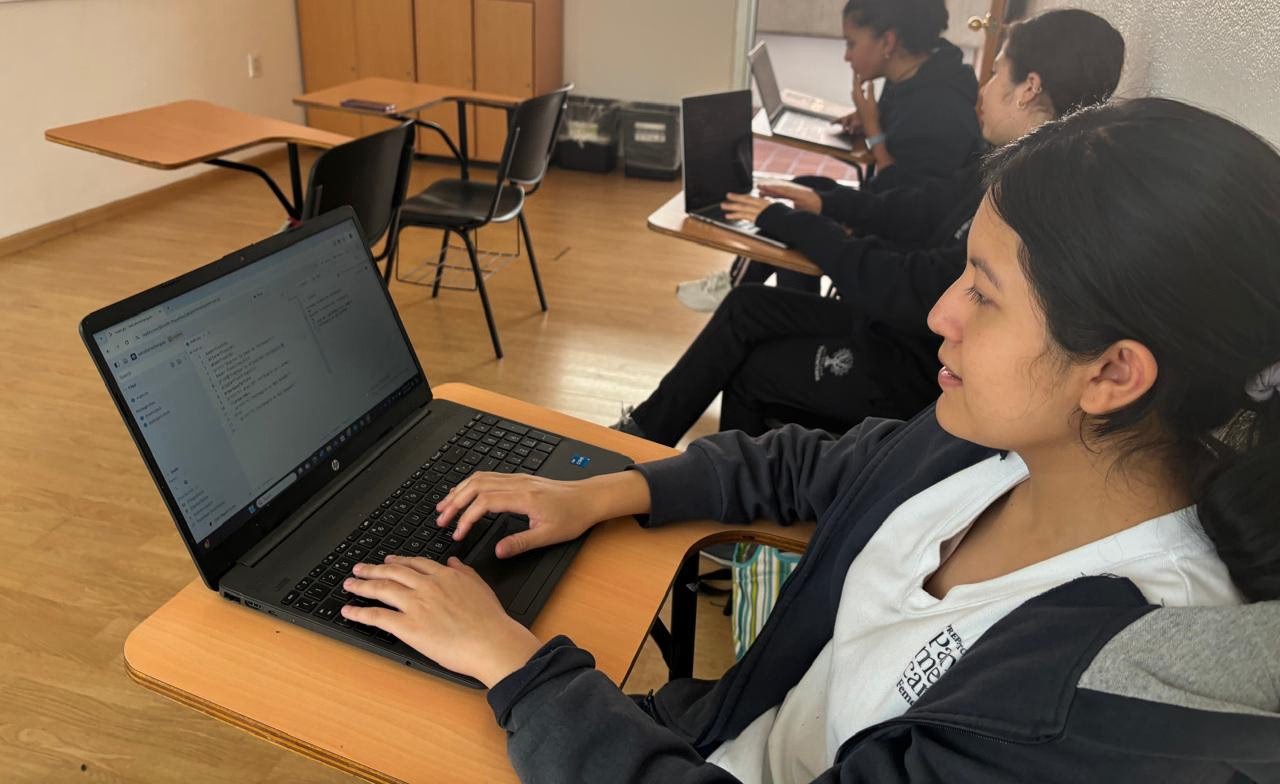 Judith working on her laptop at school