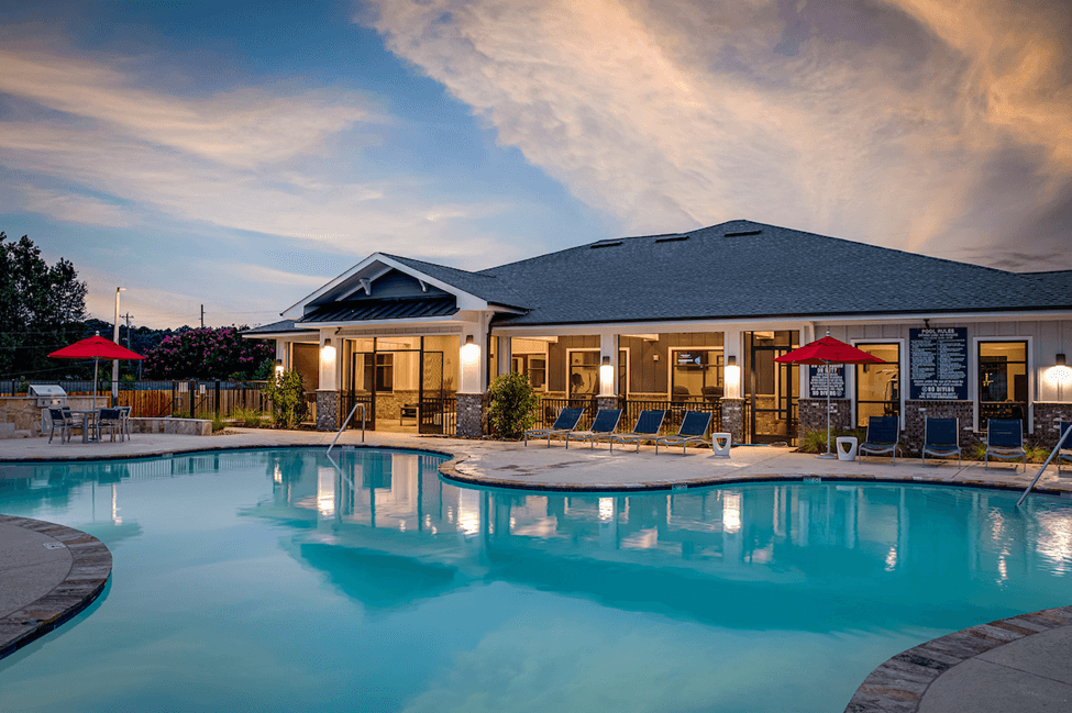 Clubhouse and pool area at The Preserve at Tech in Ruston, Louisiana, at dusk.
