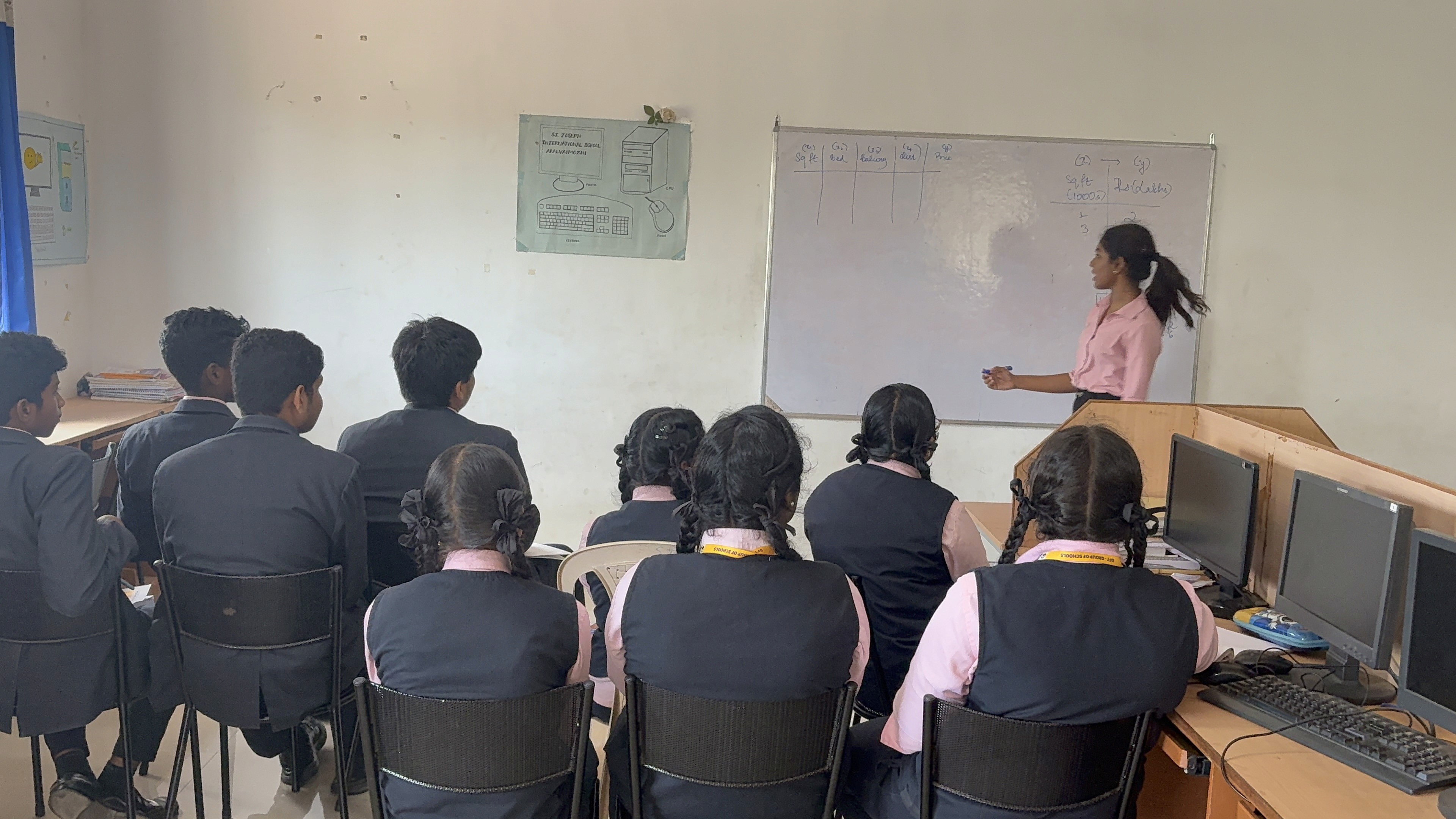 A man stading with Surfboard