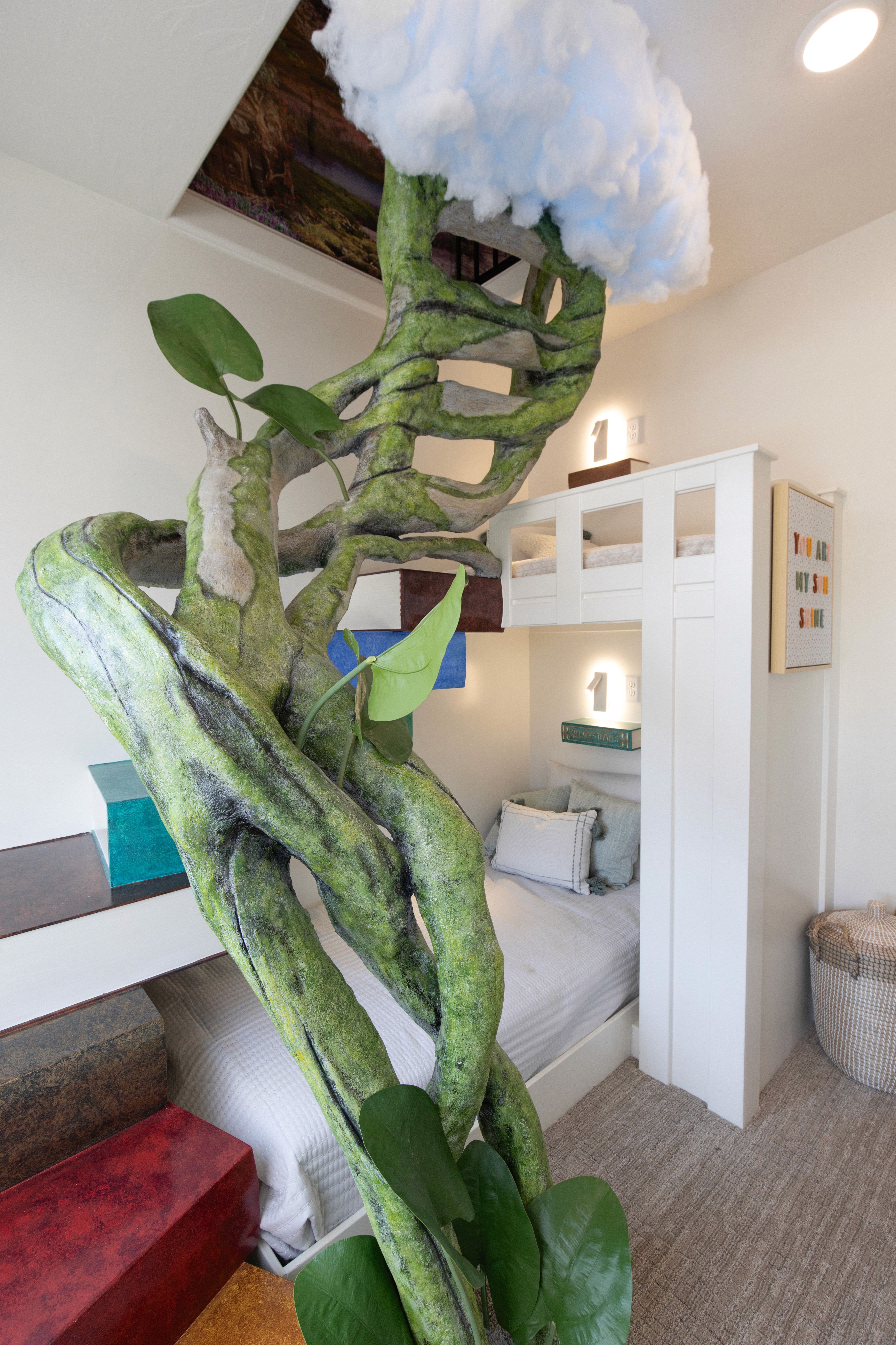 Custom staircase and handrail based off of books and jack and the bean stalk leading to a bunk bed and loft in Hurricane, Utah.