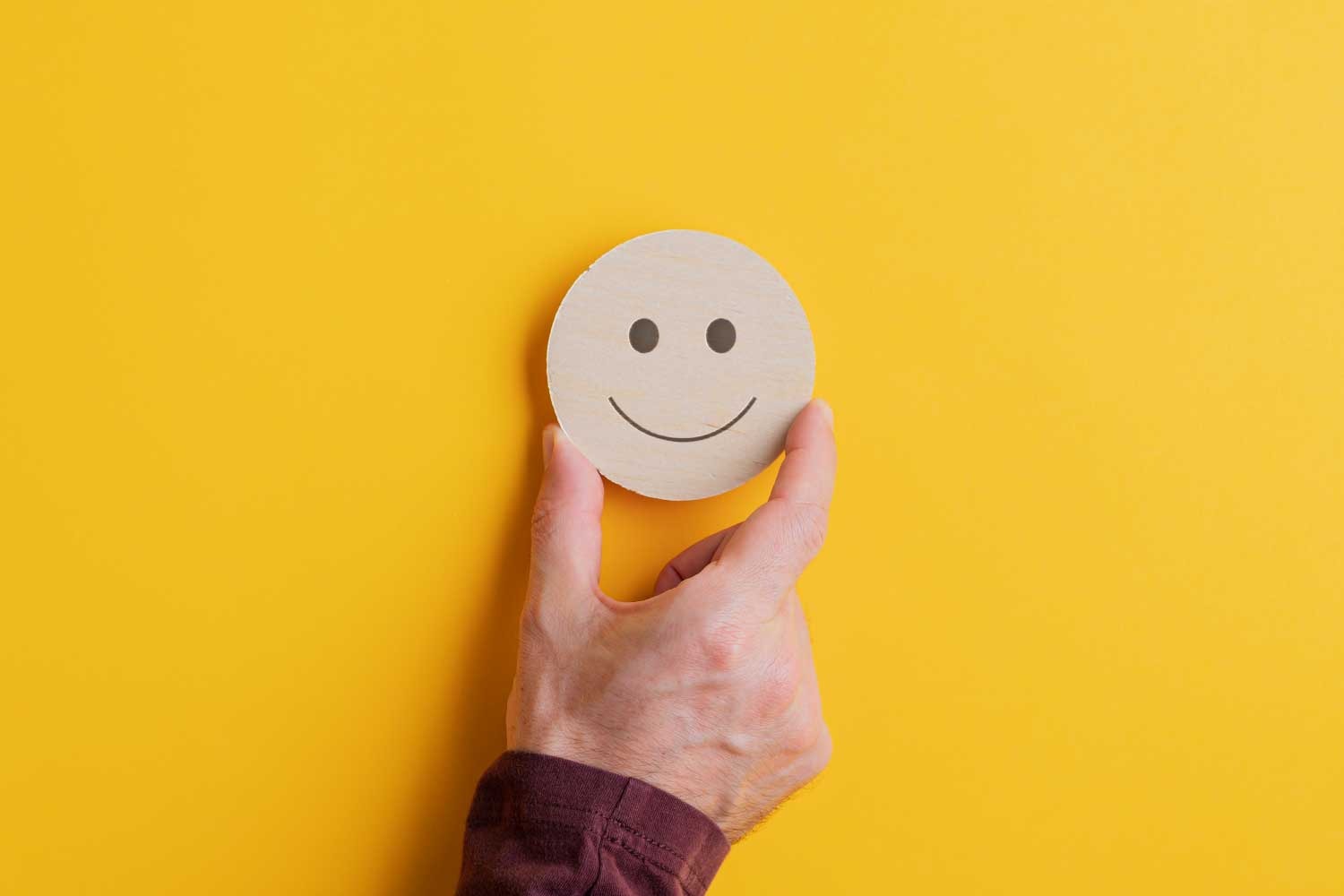 Ícone de satisfação do cliente representando experiência positiva em serviços de TI - FindUP - Inteligência emocional