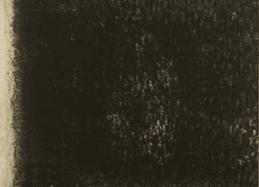 A minimalist abstract print or painting dominated by a solid, rectangular block of dark brown or black charcoal pigment. The surface shows a rough, speckled, and porous texture, allowing faint specks of light to peek through the dark medium. On the far left margin, the clean, uneven edge of the raw, light beige paper or canvas backing is exposed, providing a stark contrast to the dark block.a little bit fur like in 2-D
