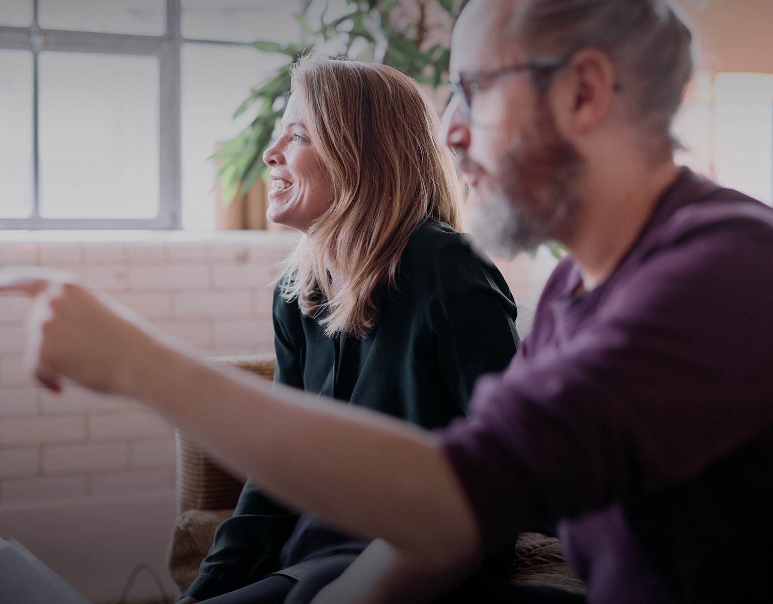 Thank you for getting in touch with Valliance header image of three of the team in discussion around their laptops
