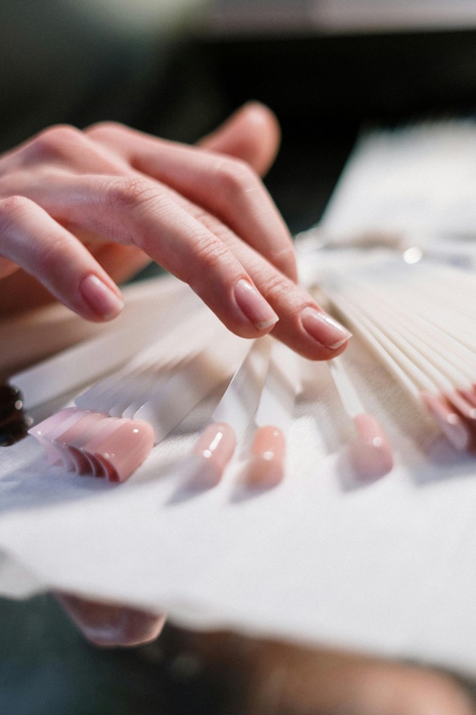 Woman selecting nail polish samples