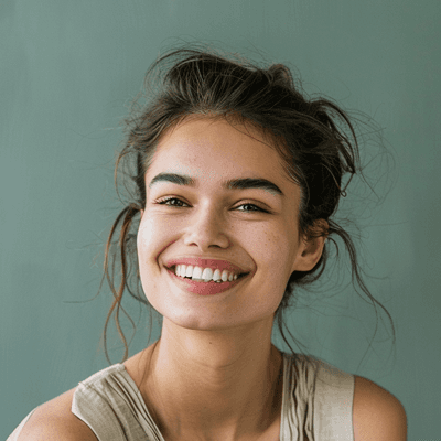 Young brunette woman with tied hair, bright smile, natural light, landscaping client