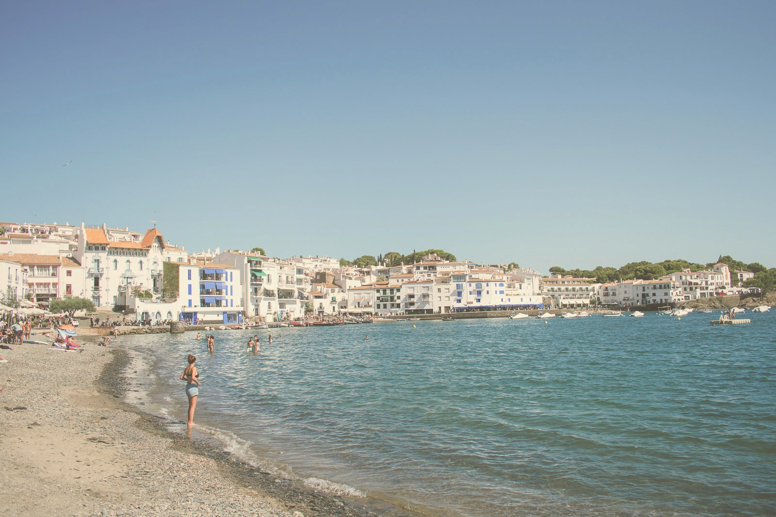 blue and white painted houses on the cliff
