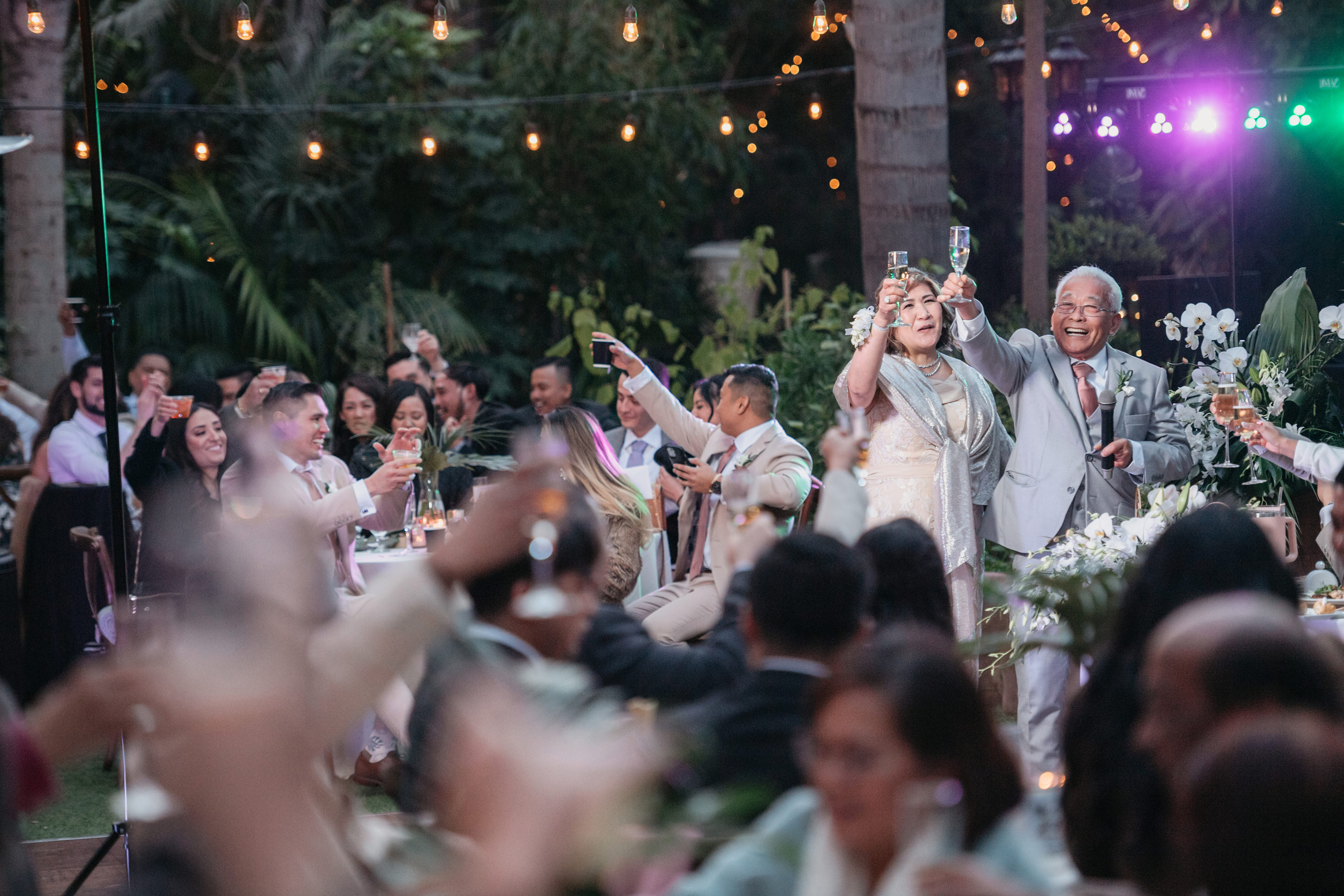 Flat lay wedding details with bouquet, rings, and sparkling bridal heels