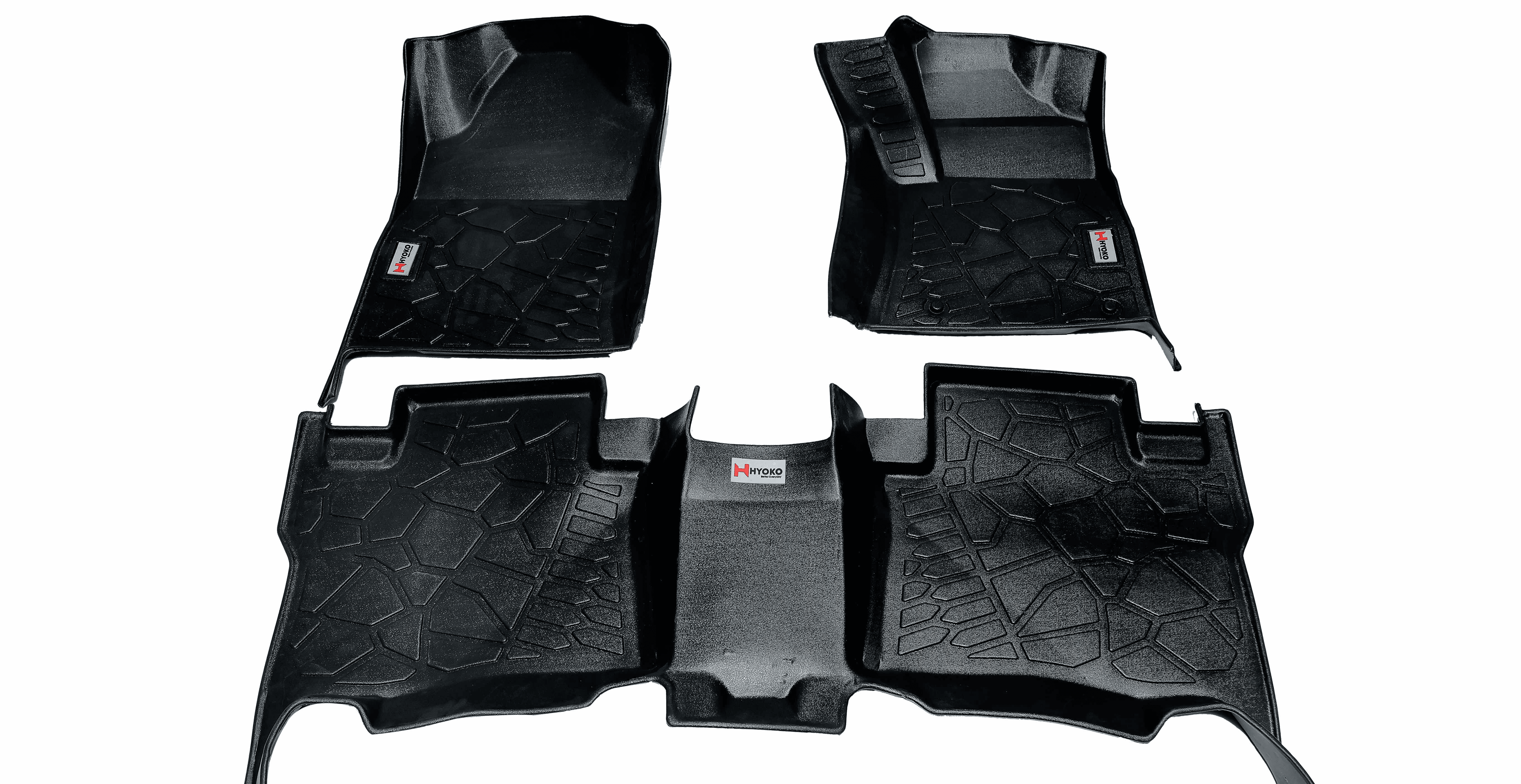 Set of custom-fit black car floor mats with raised edges and anti-slip texture for full interior coverage.