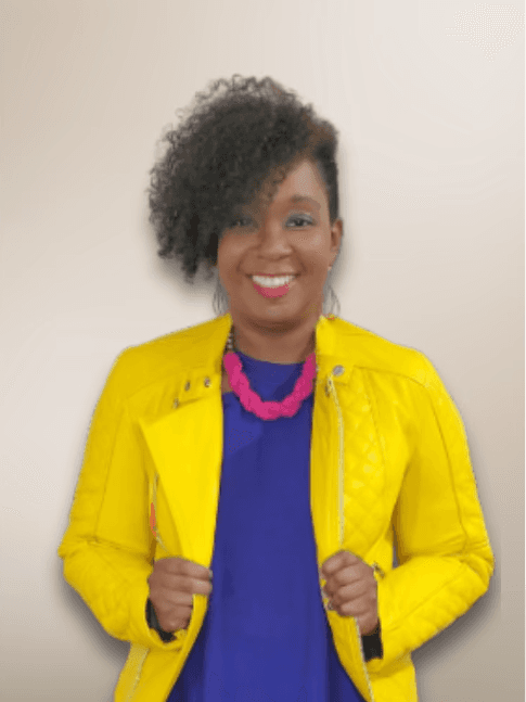 Portrait of Cerissa LaToi McKinnis, Designer and Founder, smiling and wearing a bright yellow jacket.