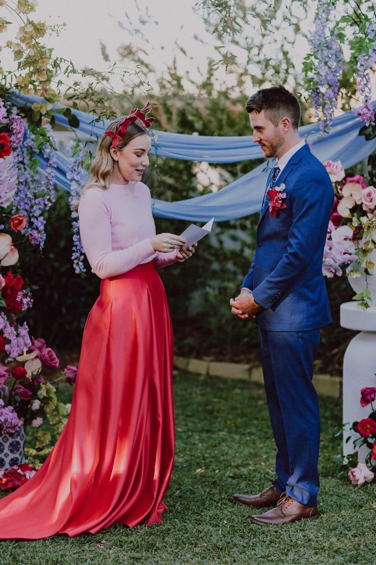 Colourful Bride & groom exchanging vows