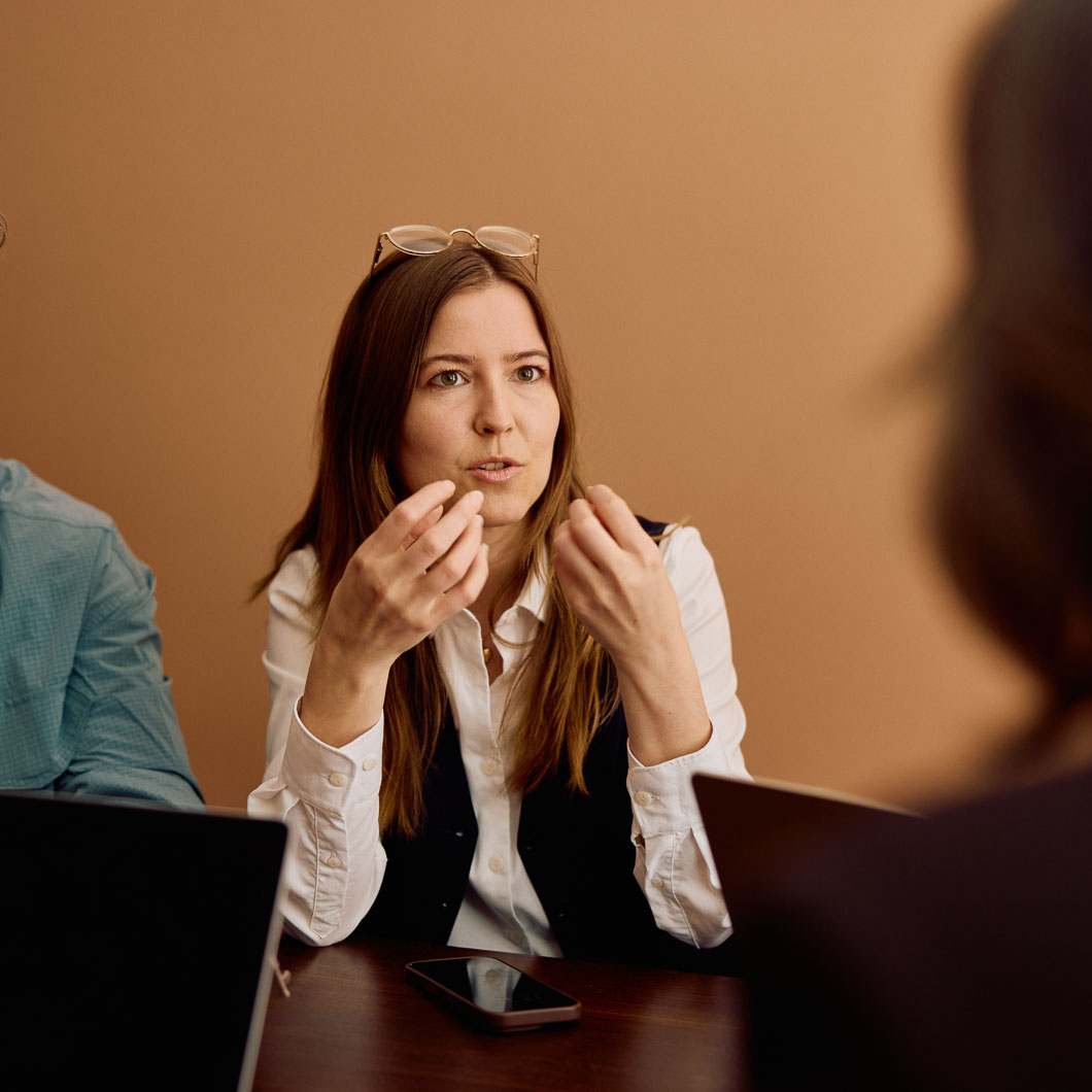 E2 visa lawyer consulting with client in office