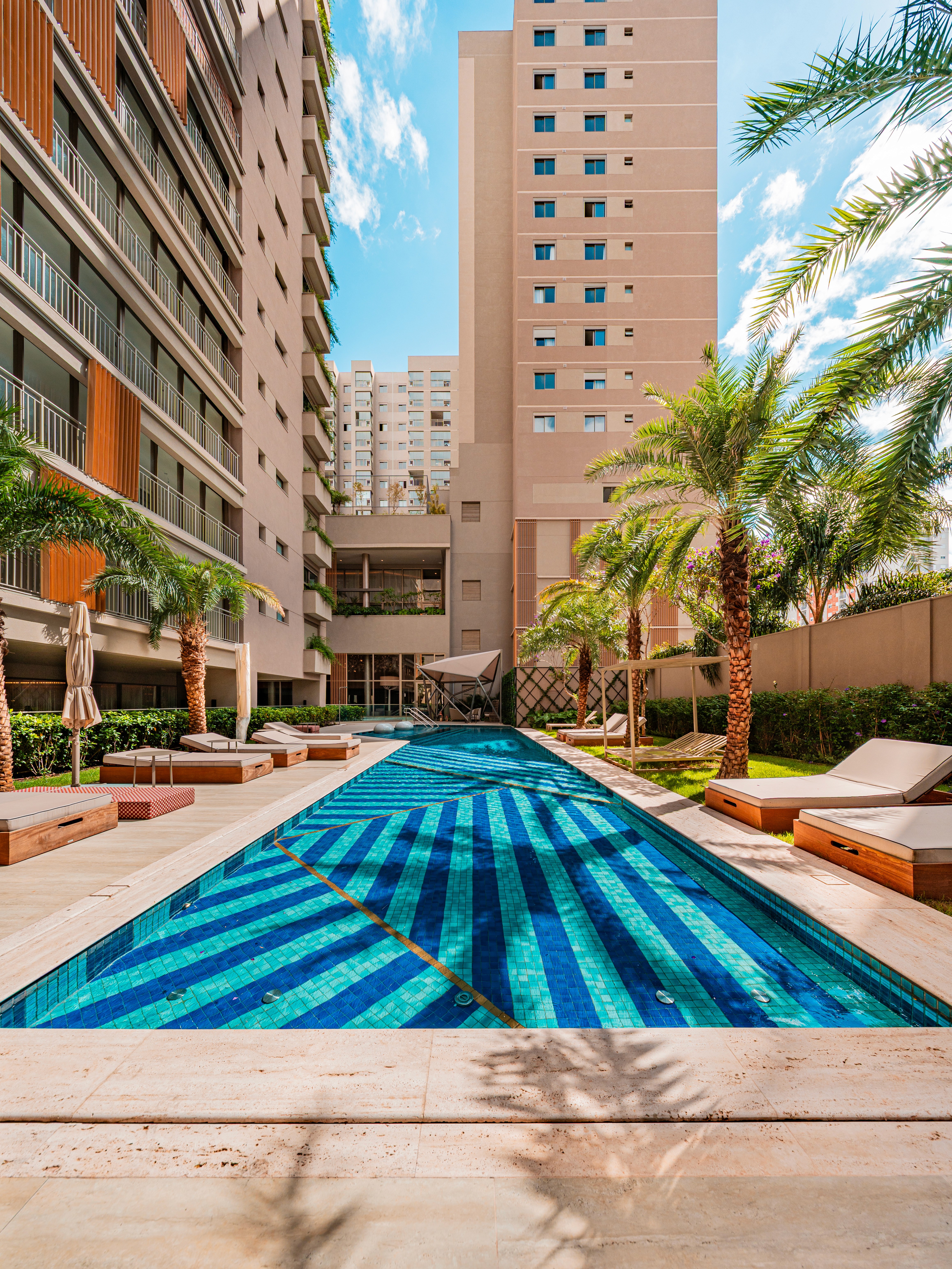 Curved modern skyscraper against a clear blue sky.