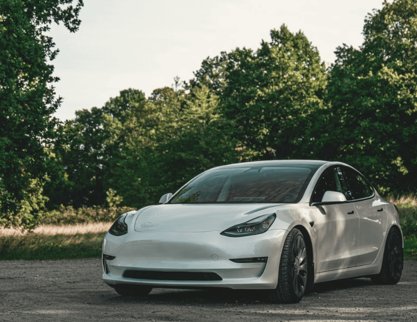 a white car parked on the side of the road