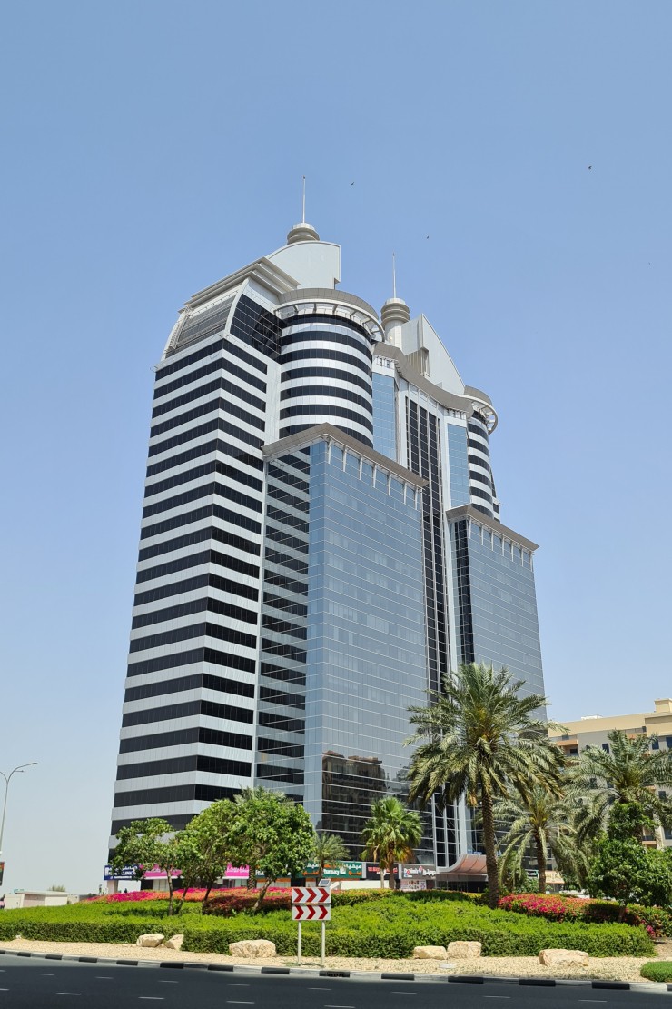 Street view of the SIT Tower entrance and surrounding infrastructure in the heart of Silicon Oasis.
