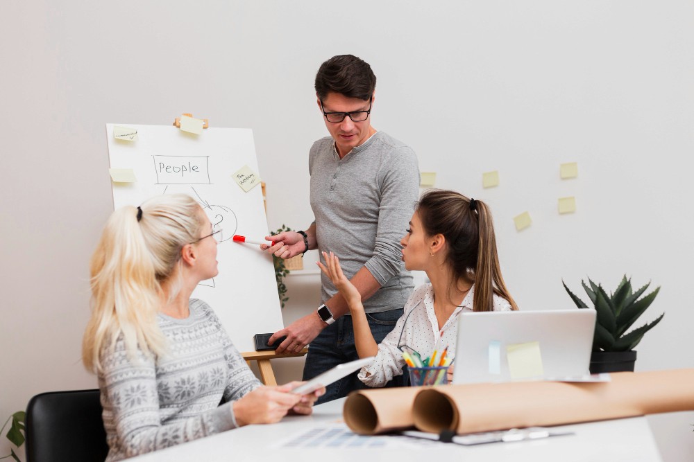 Creative team reviewing layout with intentional white space