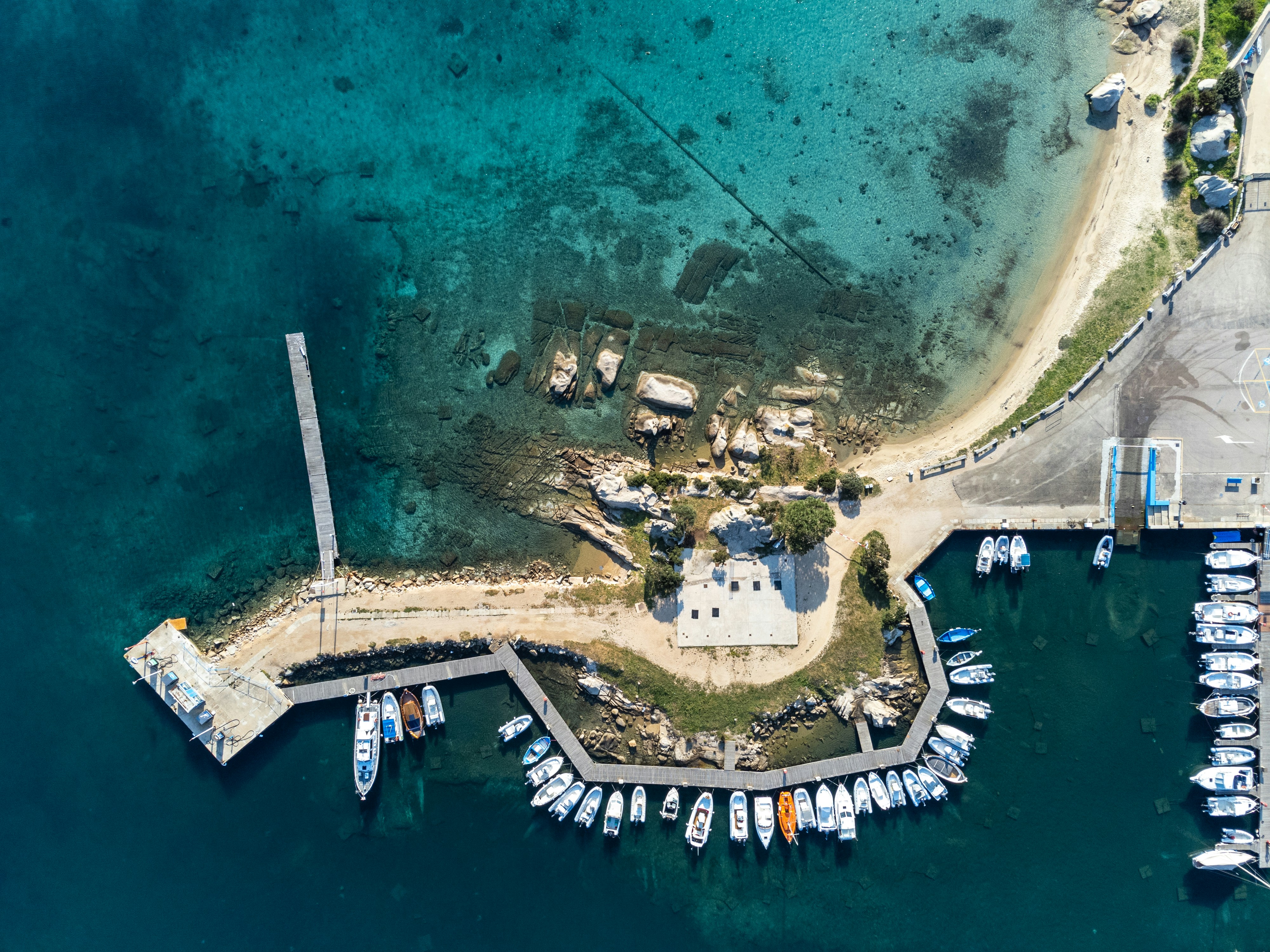 an aerial view of a marina with boats