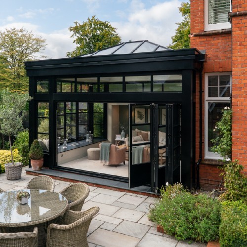 Property extension with patio seating area