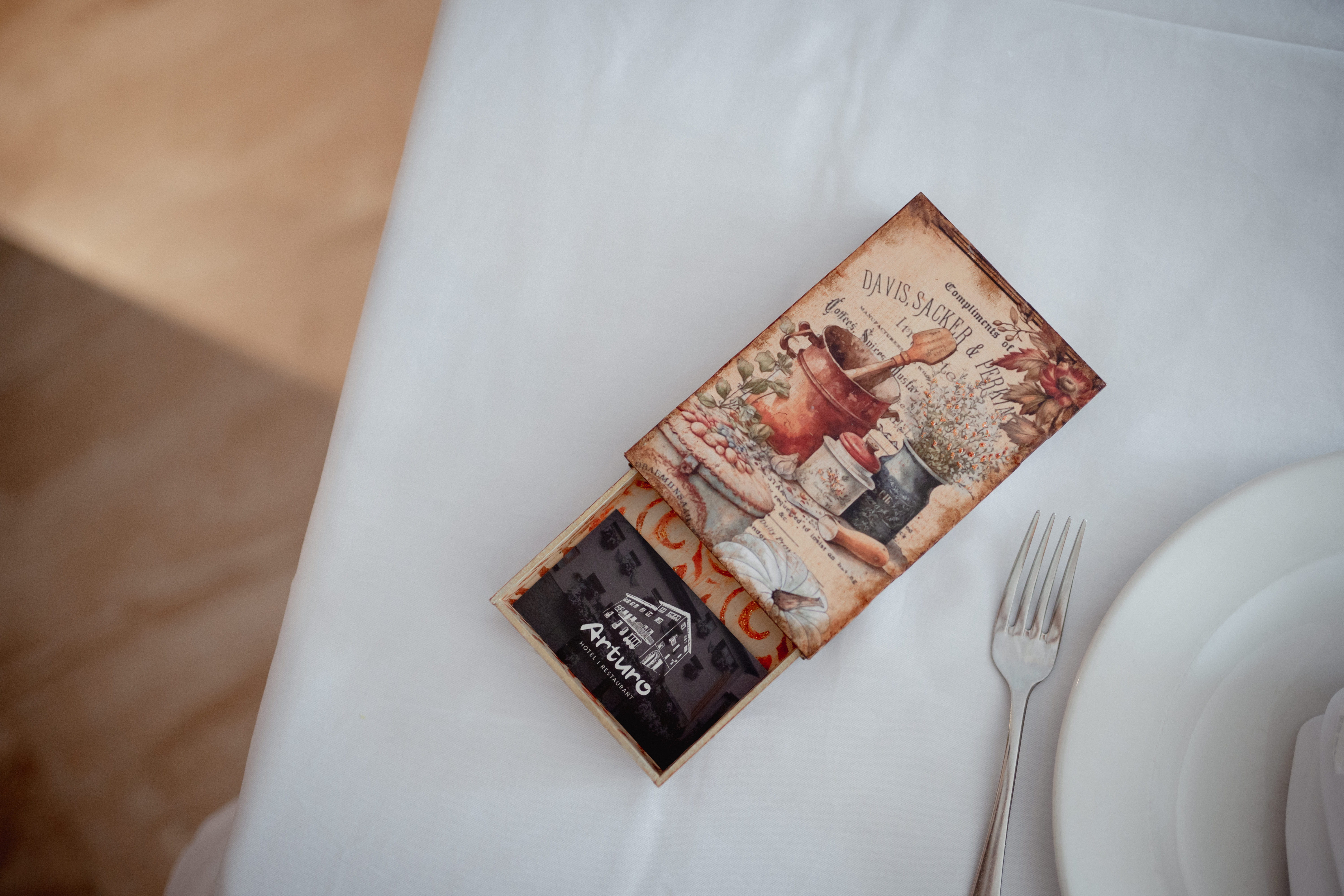 traditional dark interior with fireplace, large mirror and chandelier