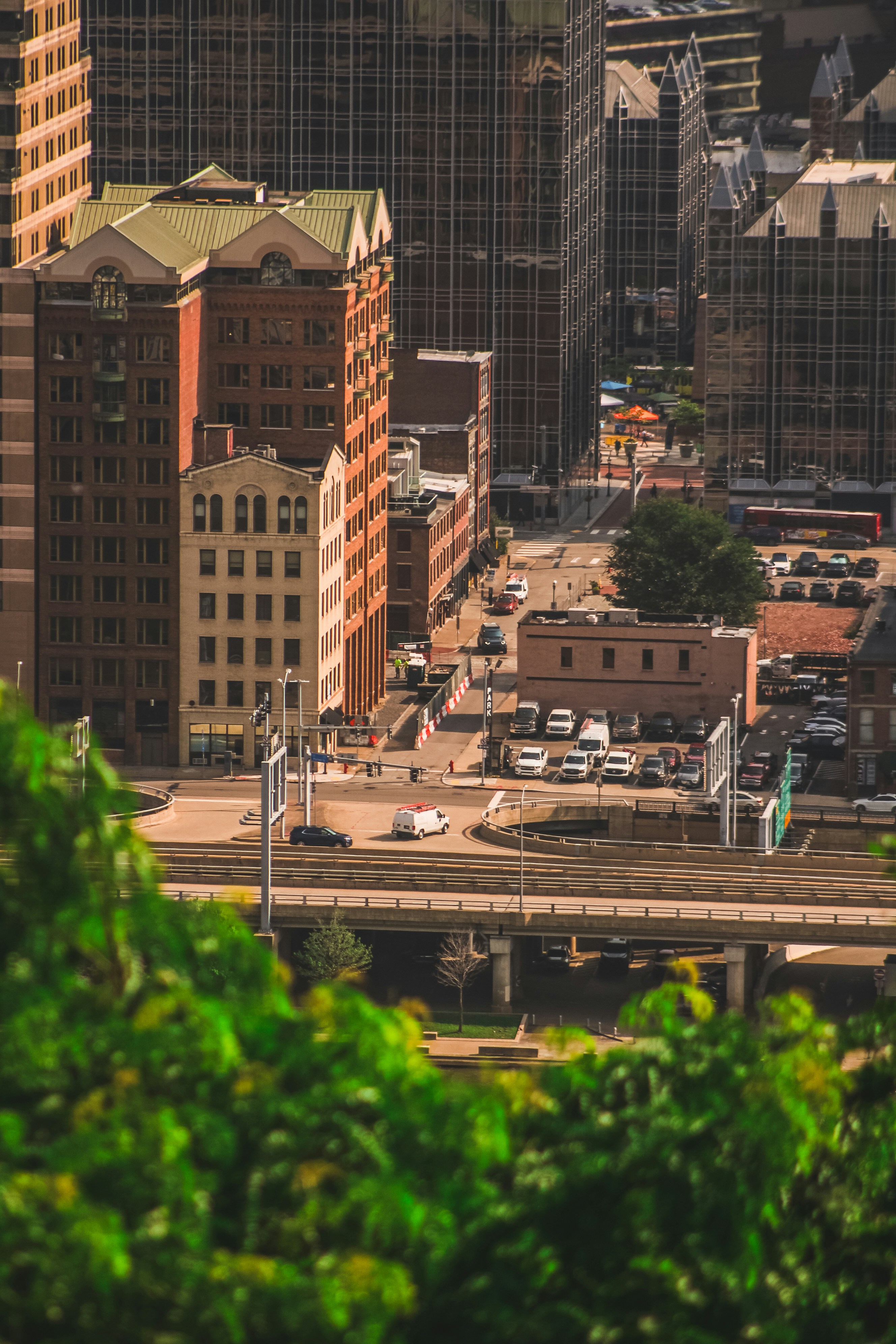 City buildings and streets with cars and trees.
