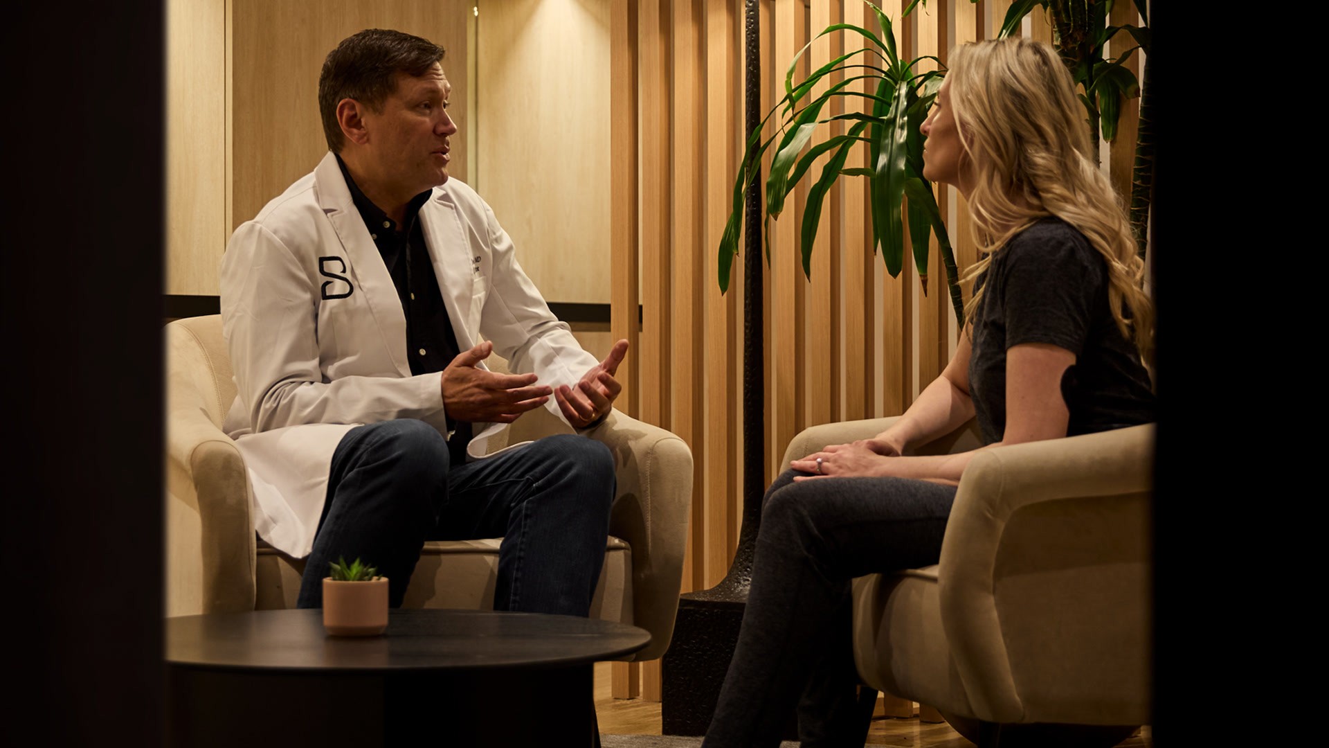 Doctor consulting with a Biograph member during an executive physical focused on preventive health and early disease detection.