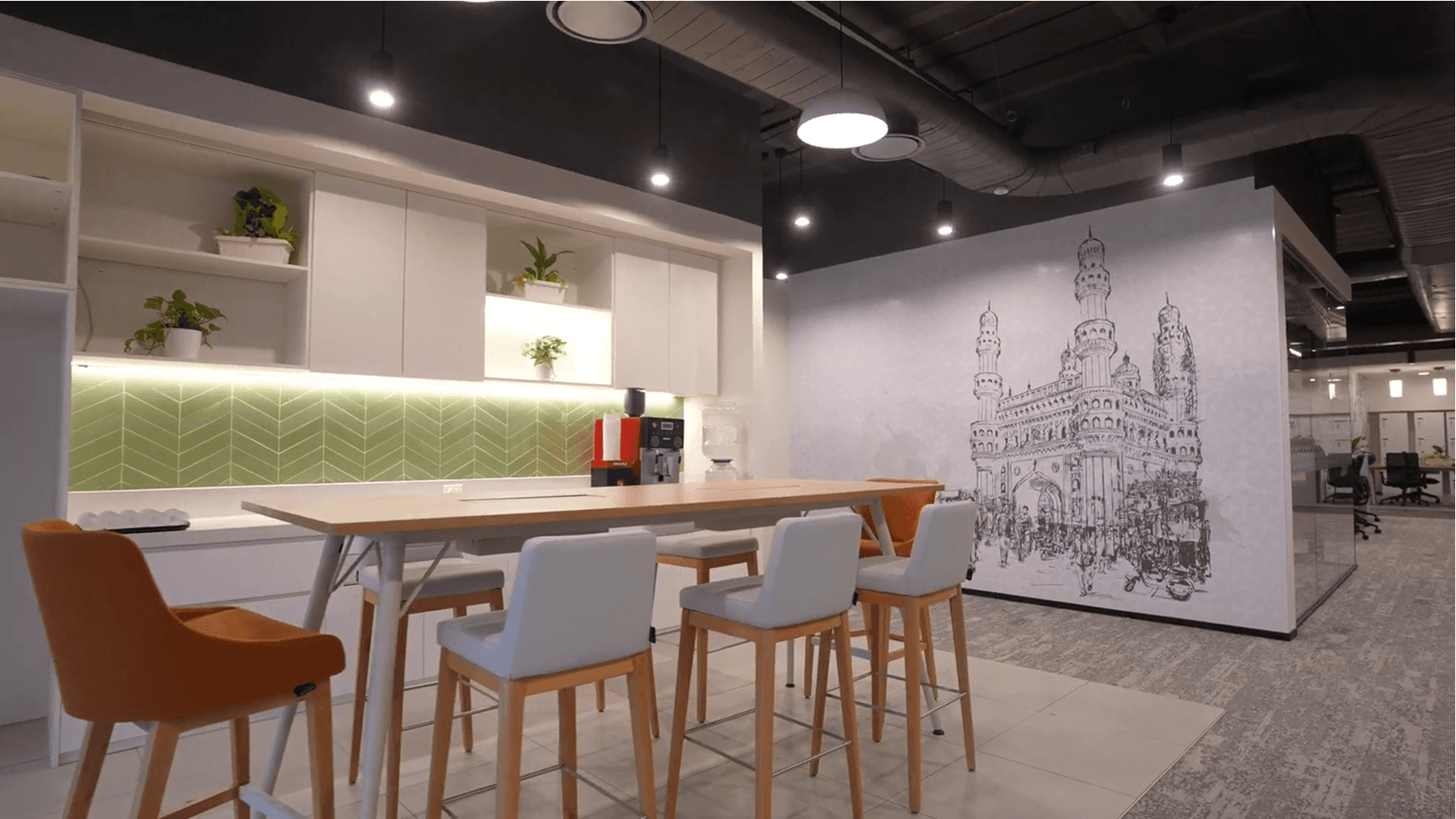 Image of a modern office interior featured in a real estate and construction video.