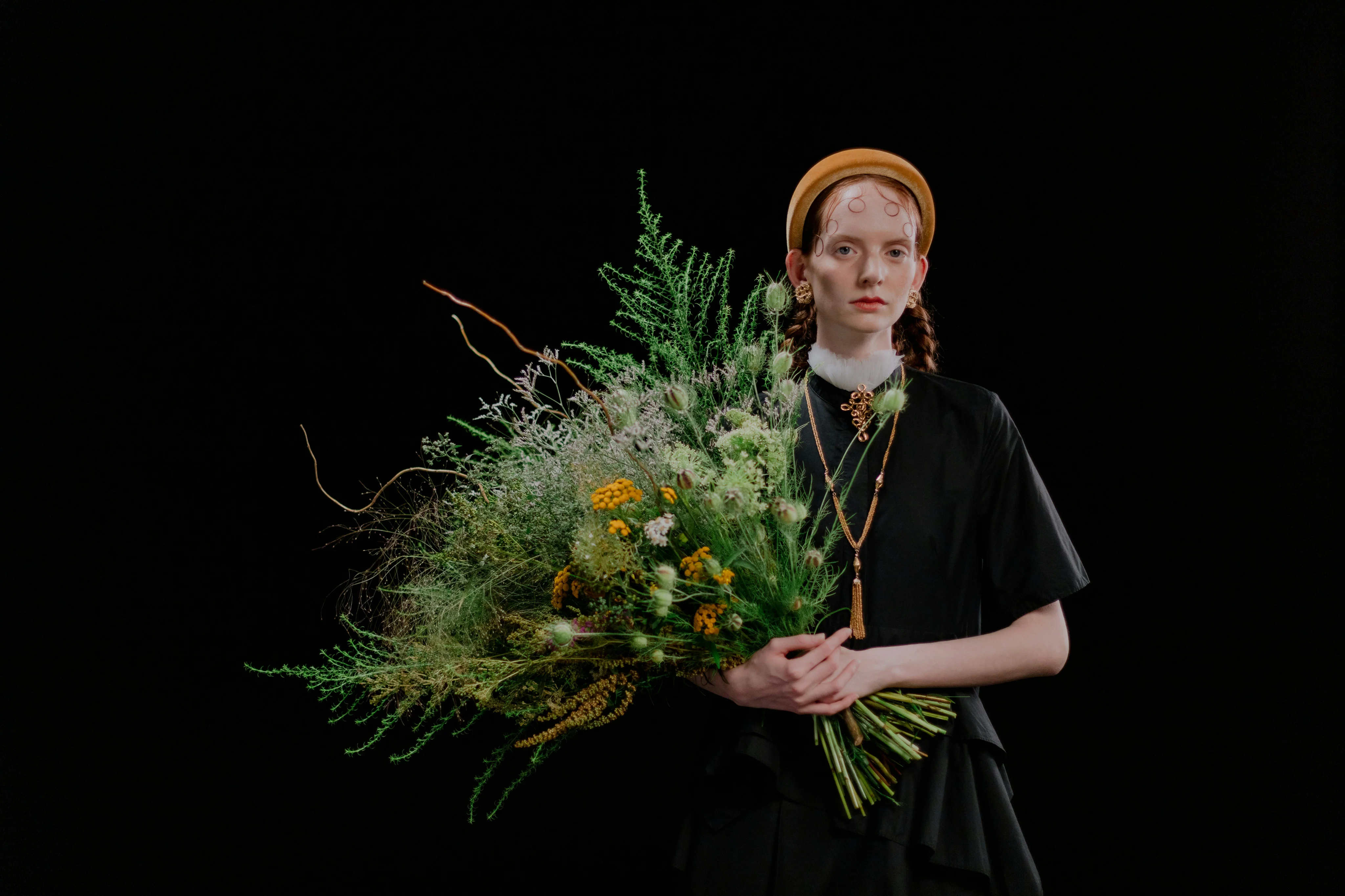 Victoria Hayes portrait with set of flowers