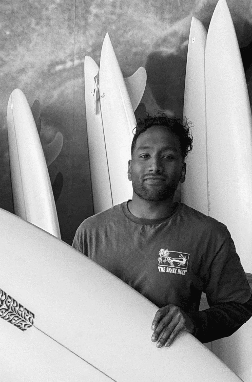 a black and white photo of a woman in a dress