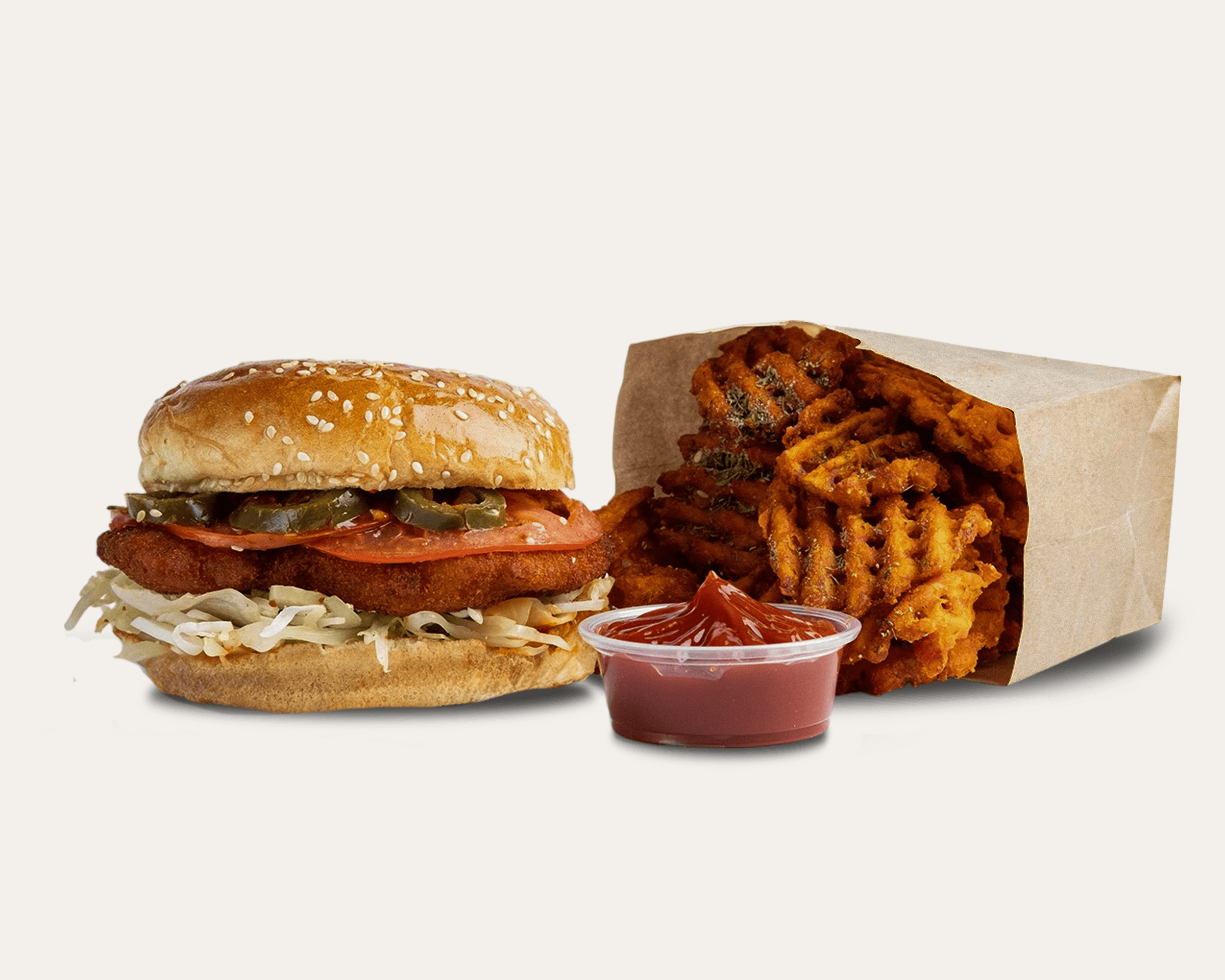 Crispy chicken patty, sliced tomatoes,  white cabbage, onions, jalapeños, & Moroccan hot sauce served with sweet potato fries. 