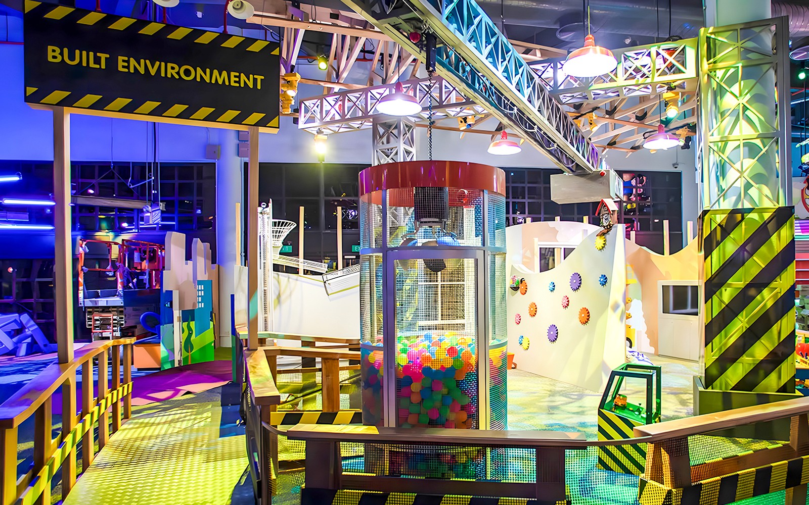 Interactive play area at KidsSTOP Singapore with colorful structures and ball pit.
