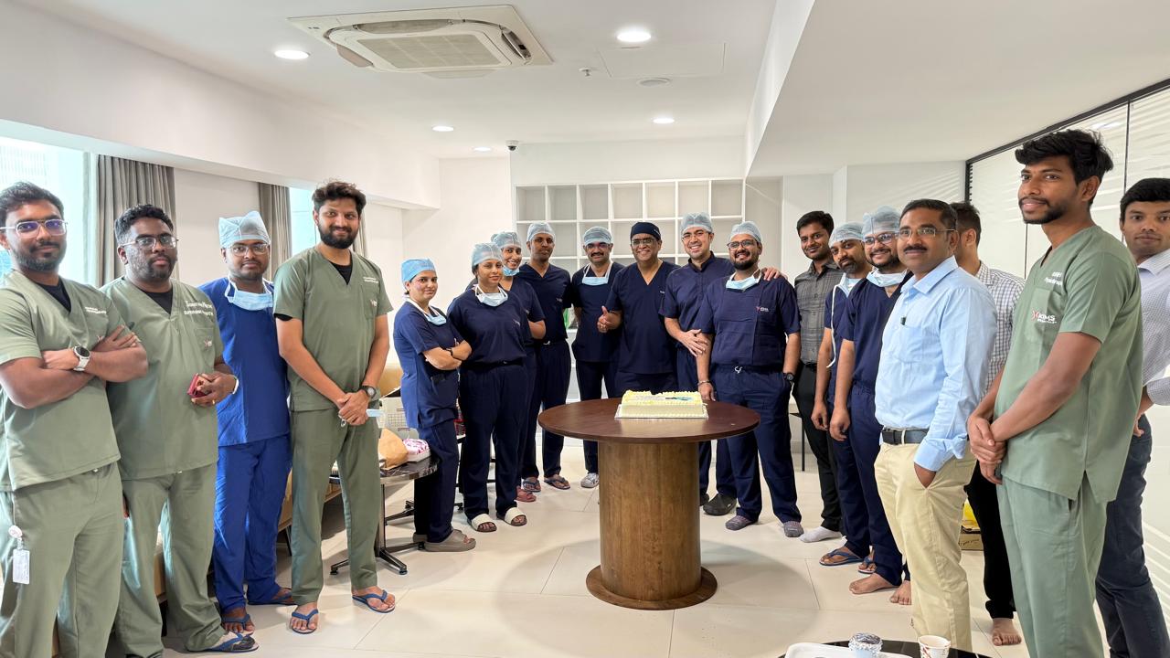 A large gold futuristic tank on a rooftop overlooking a skyscraper city