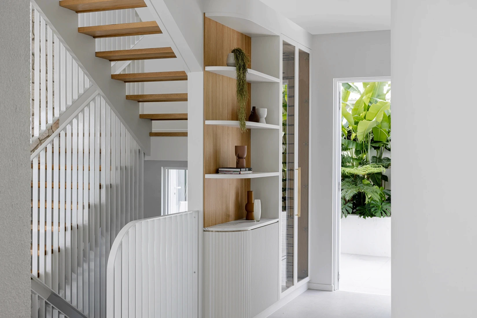 Entryway of Clare House with staircase and integrated joinery