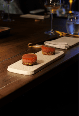 Bottles of olive standing on the marble counter