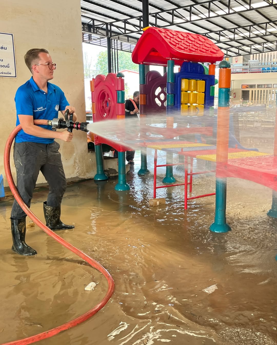 man in black crew neck t-shirt wearing black framed sunglasses