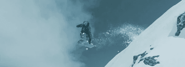 Image of a snowboarder jumping.