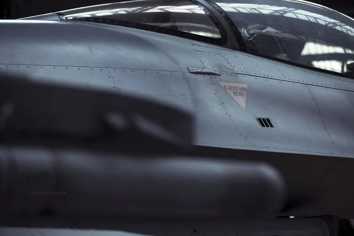 Fighter jet cockpit in a hangar — Semantic defense AI systems