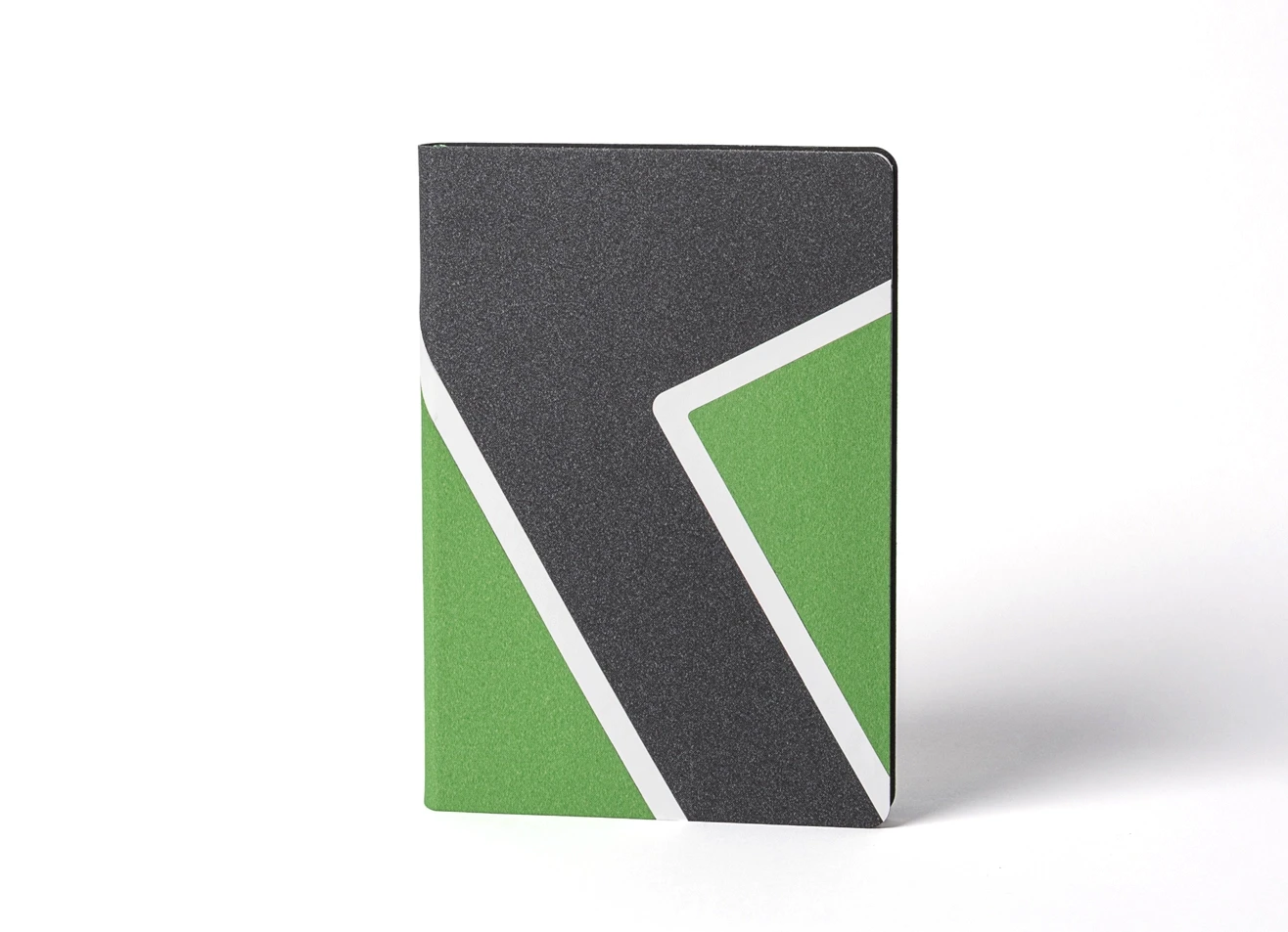 Front view of geometric black and green notebook.