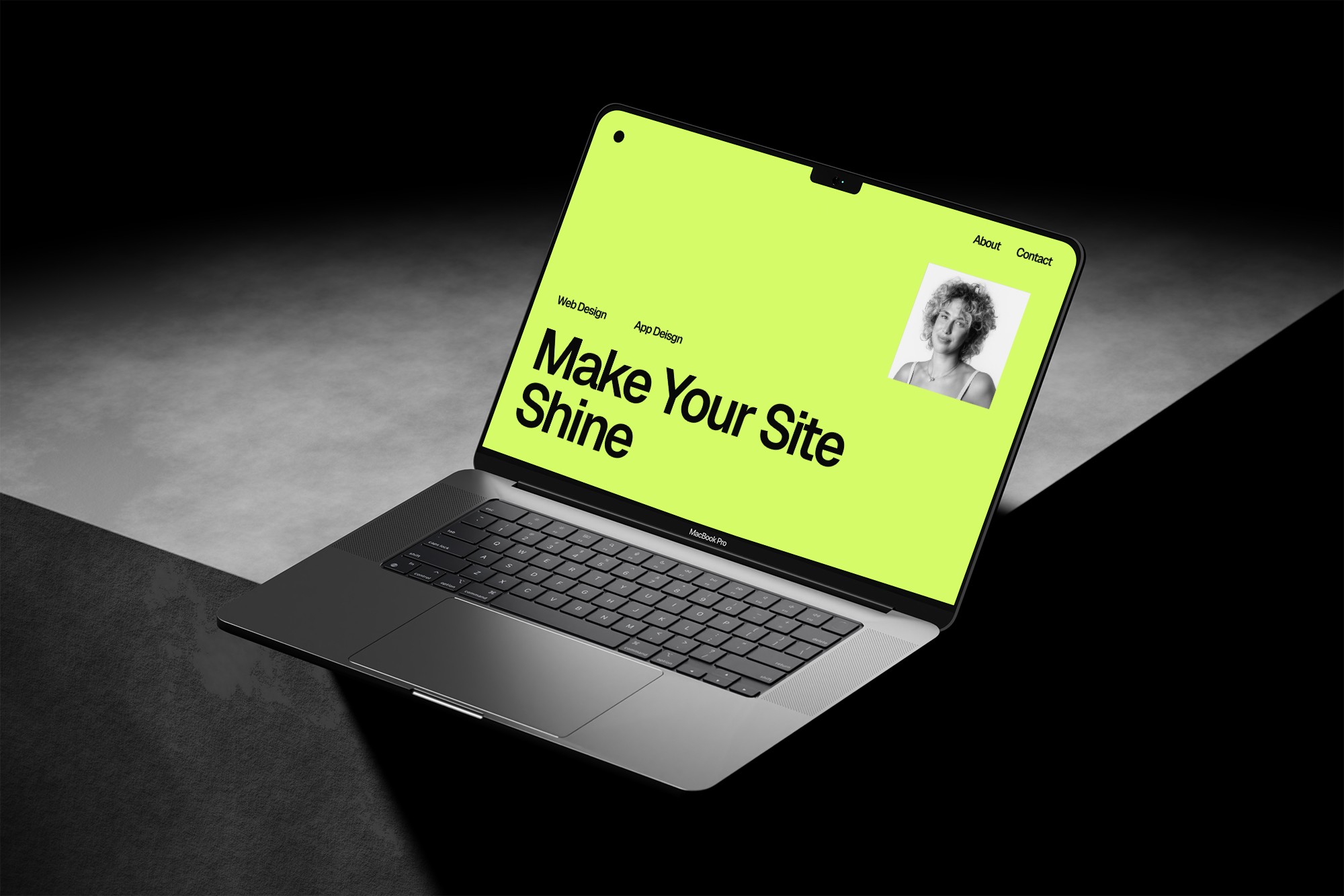 Laptop on concrete, website on screen