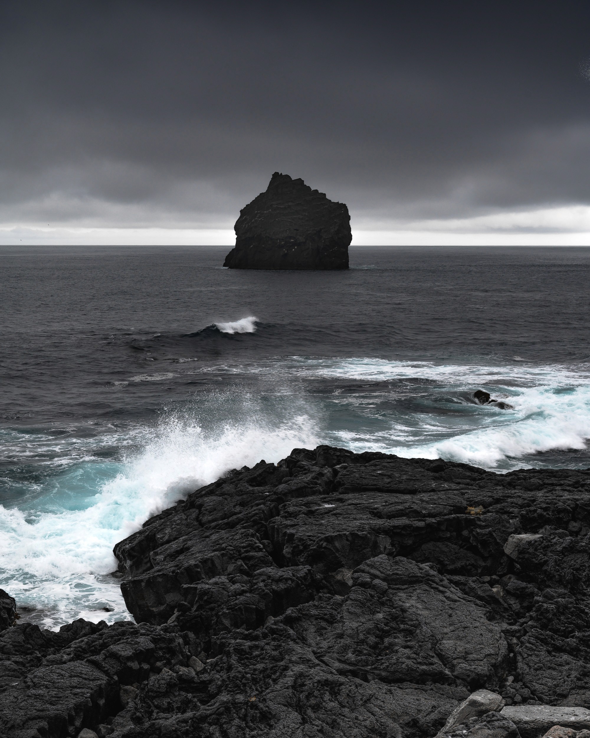 Reykjanes Peninsula waves crash before a seastack